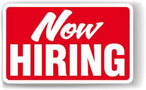A bold red and white sign that reads 'Now Hiring'.