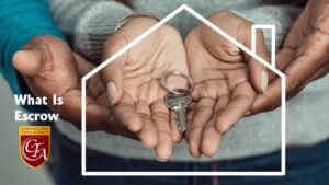 Hands holding a house key inside a house-shaped outline.