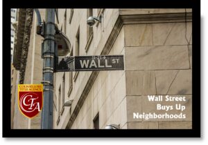 Wall Street sign on a city building corner.