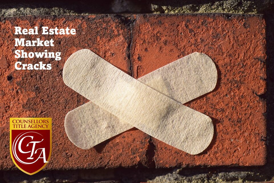 Two adhesive bandages crossed on a brick wall symbolizing repair.