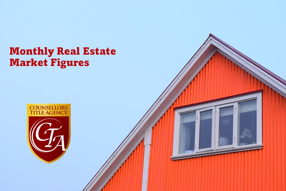 Bright orange house under clear sky with real estate branding.
