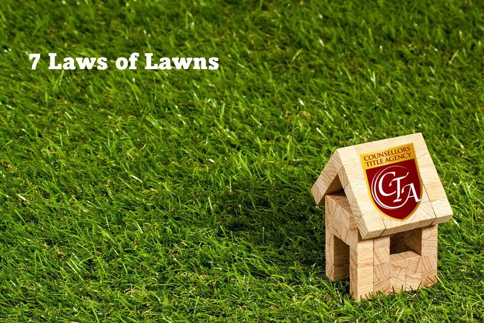 A miniature house on lush green grass with 'Lawns of Lawns' text.