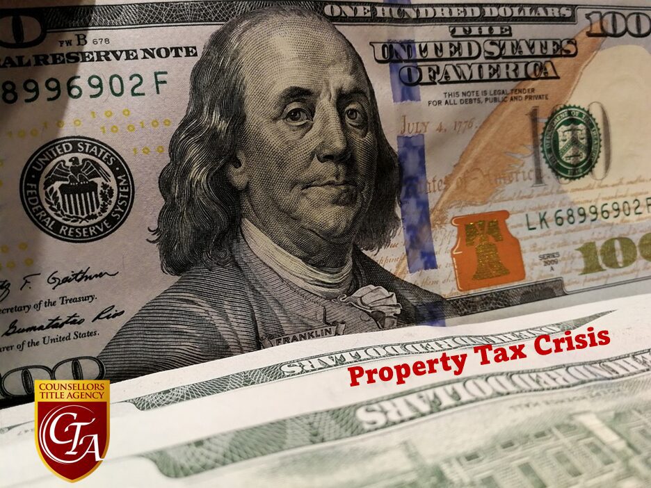 Close-up of a $100 bill and a property tax credit document.