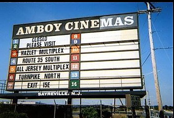 A cinema marquee listing various movie theaters and their locations.