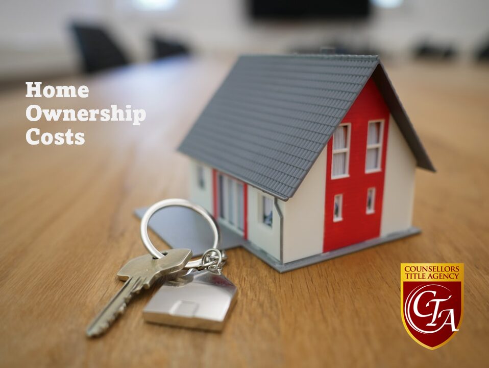 A small model house with keys, symbolizing home ownership benefits.