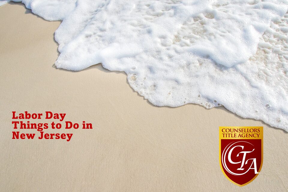 Ocean wave gently washing over sandy beach in New Jersey.
