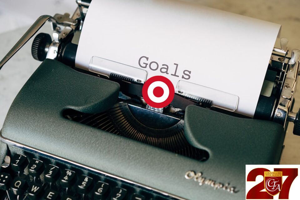 The word 'Goals' typed on a paper in a typewriter with a target logo.