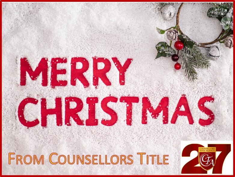 Festive 'Merry Christmas' message with holly decoration on snow.