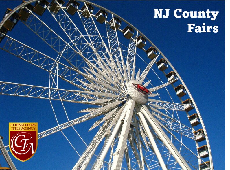 A large Ferris wheel against a clear blue sky at NJ County Fair.