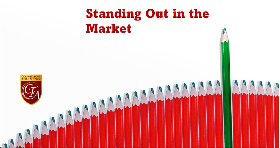 Red pencil standing out among uniform pencils, symbolizing uniqueness in the market.