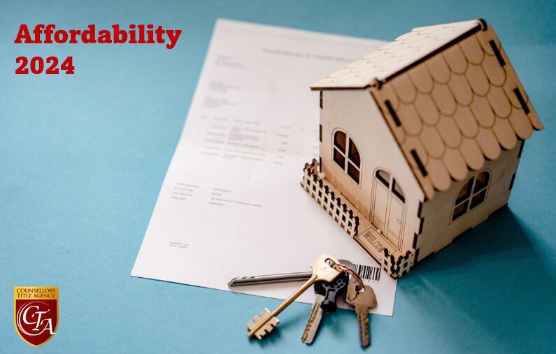 House model with keys and a document, symbolizing home ownership or mortgage.