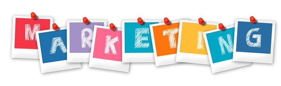 Colorful paper squares pinned to a board spelling 'SKETCH'.