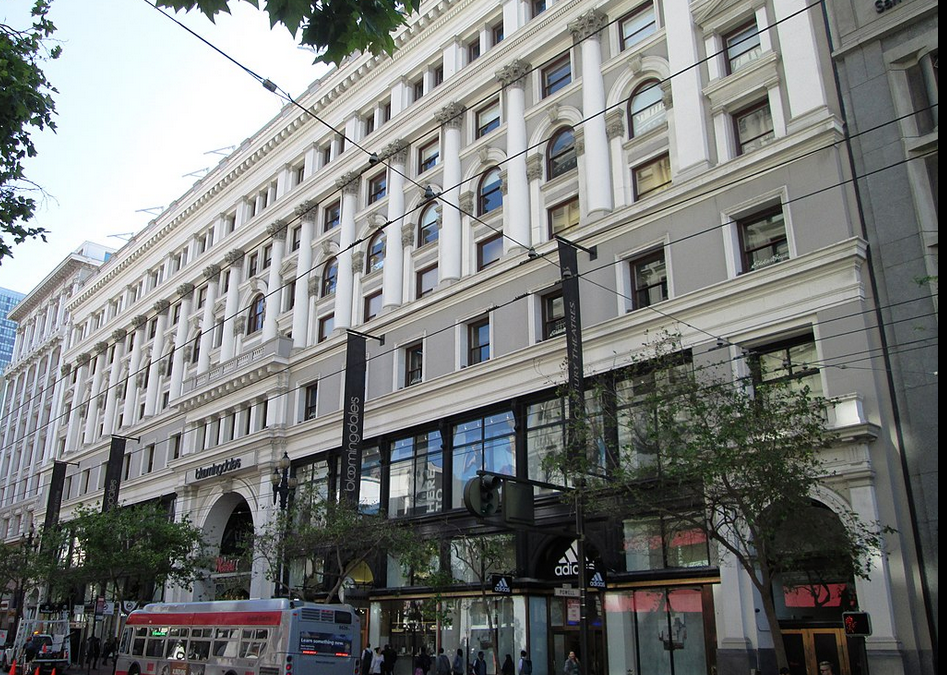 City street with historic department store building.