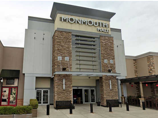 Shopping mall entrance with stone facade.