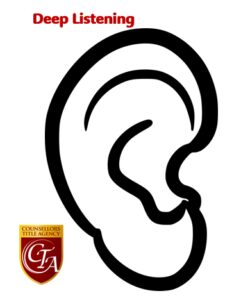 Black and white simple ear illustration with a small logo.