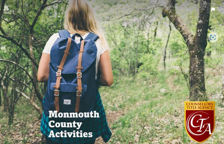 Woman hiking in Monmouth County forest trail.