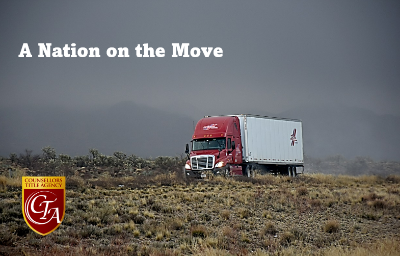 Red truck driving through foggy landscape.