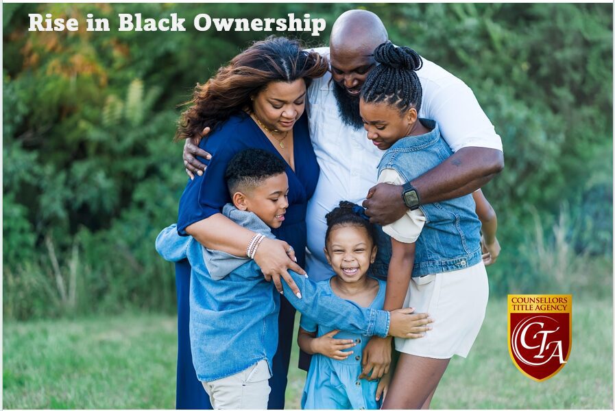A joyful Black family embracing outdoors, celebrating unity and love.