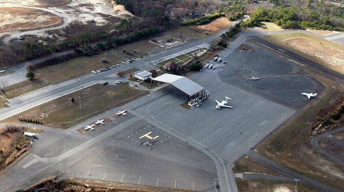 Aerial view of small airport with planes.
