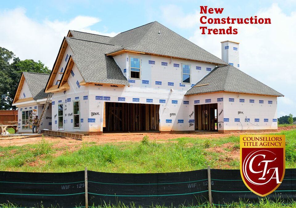 New house under construction with signage.