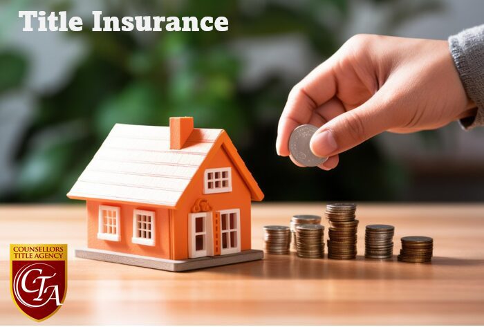 Hand placing coin near house model.
