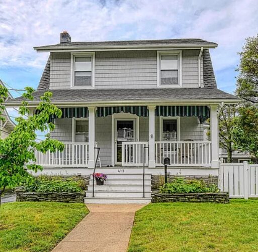 Two-story house with front porch.