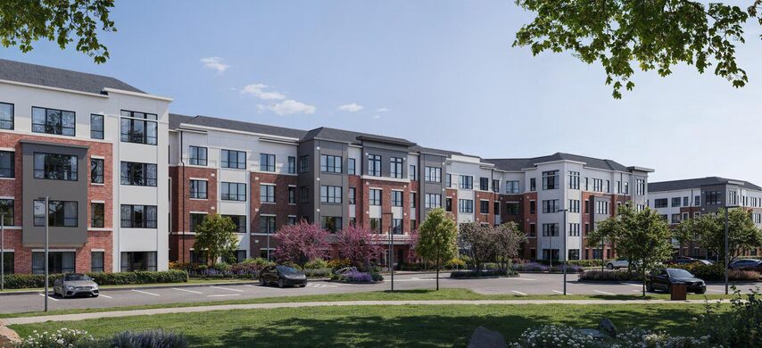 Modern apartment complex with landscaped surroundings.