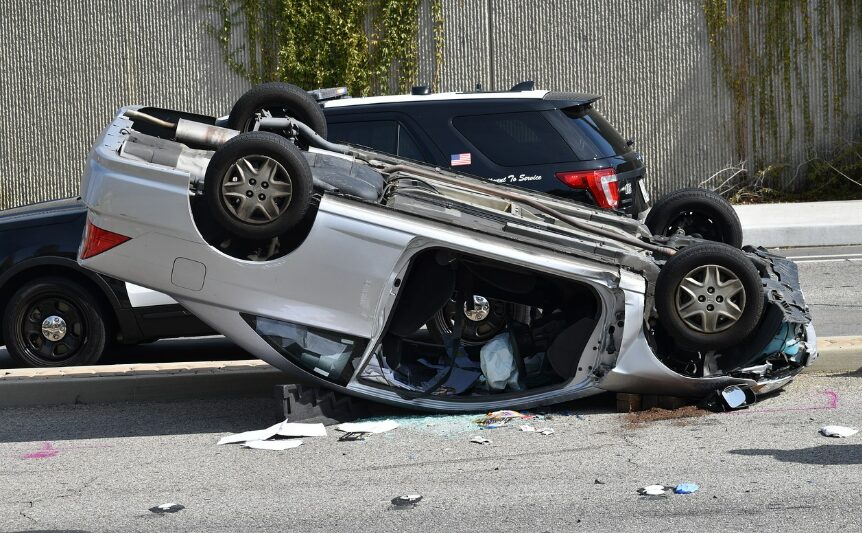 Overturned car on roadside after accident.