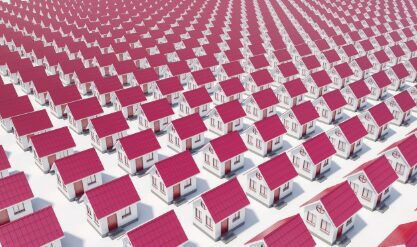 Rows of identical houses with red roofs.
